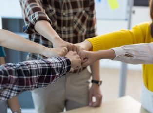 Unity and Teamwork Concept. Young business team meeting.